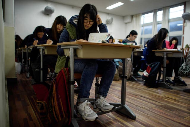 Students sit the annual Scolastic Aptitude Test at a the Poongmun high school in Seoul