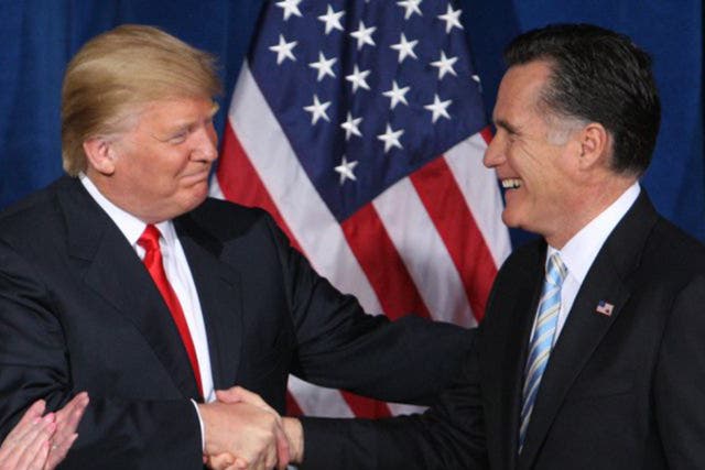 Mitt Romney shakes hands with the man he called a 'fraud' and a 'conman'