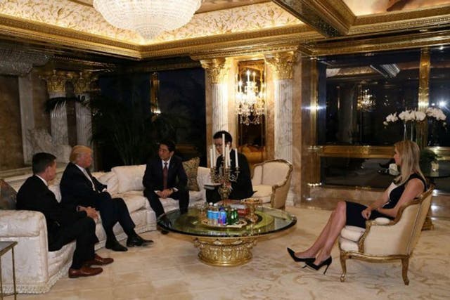 Japan's Prime Minister Shinzo Abe meets with US President-elect Donald Trump and his daughter, Ivanka at Trump Tower in Manhattan, New York