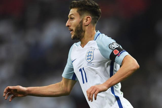 Adam Lallana sports a poppy on a black armband during England's 3-0 victory over Scotland