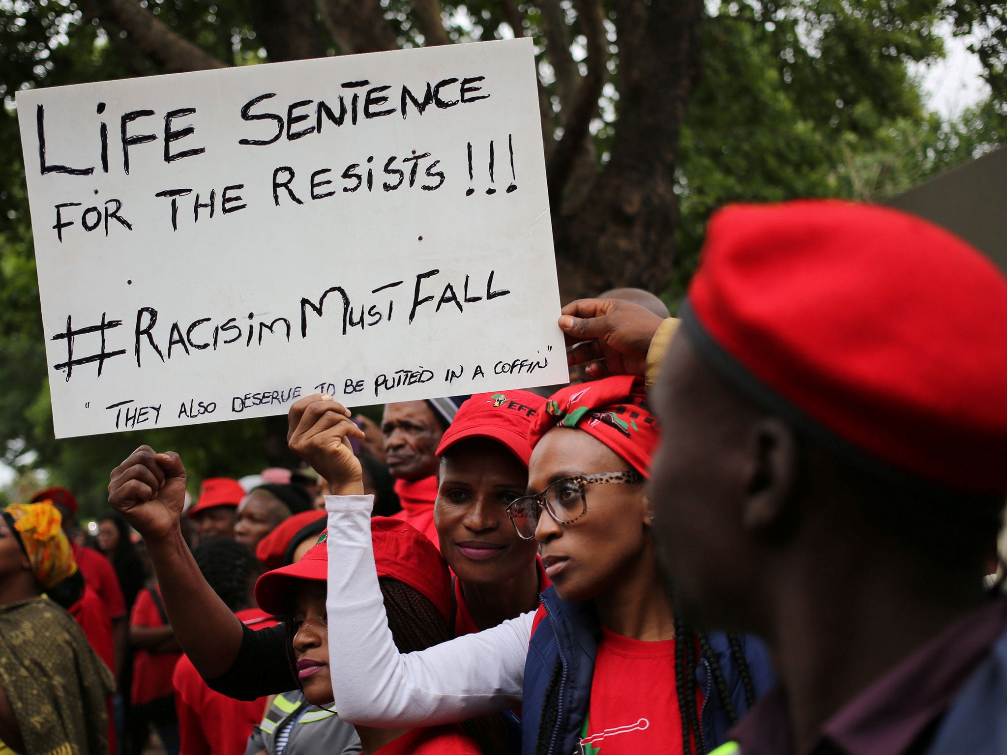 Economic Freedom Fighters (EFF) members outside a court during the trial of two men accused of forcing a black man into a coffin in Middelburg, South Africa, 16 November