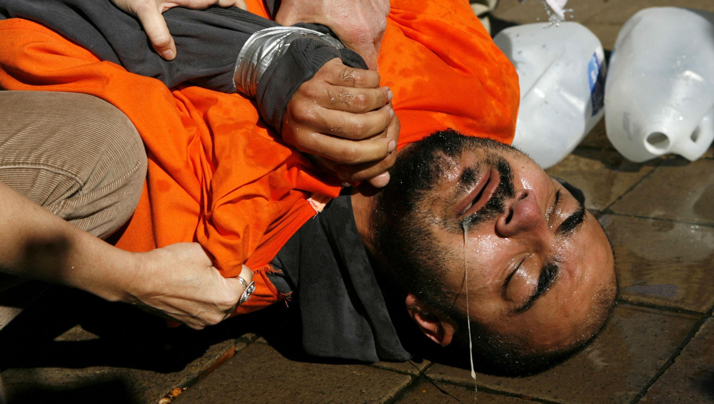 Demonstrator Maboud Ebrahimzadeh underwent a simulation of waterboarding outside the Justice Department in 2007