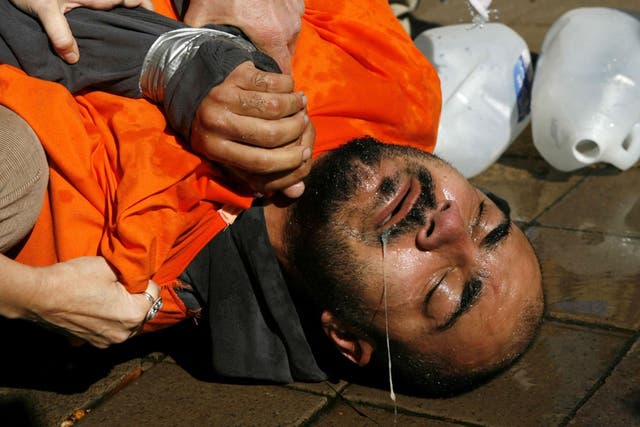 Demonstrator Maboud Ebrahimzadeh underwent a simulation of waterboarding outside the Justice Department in 2007