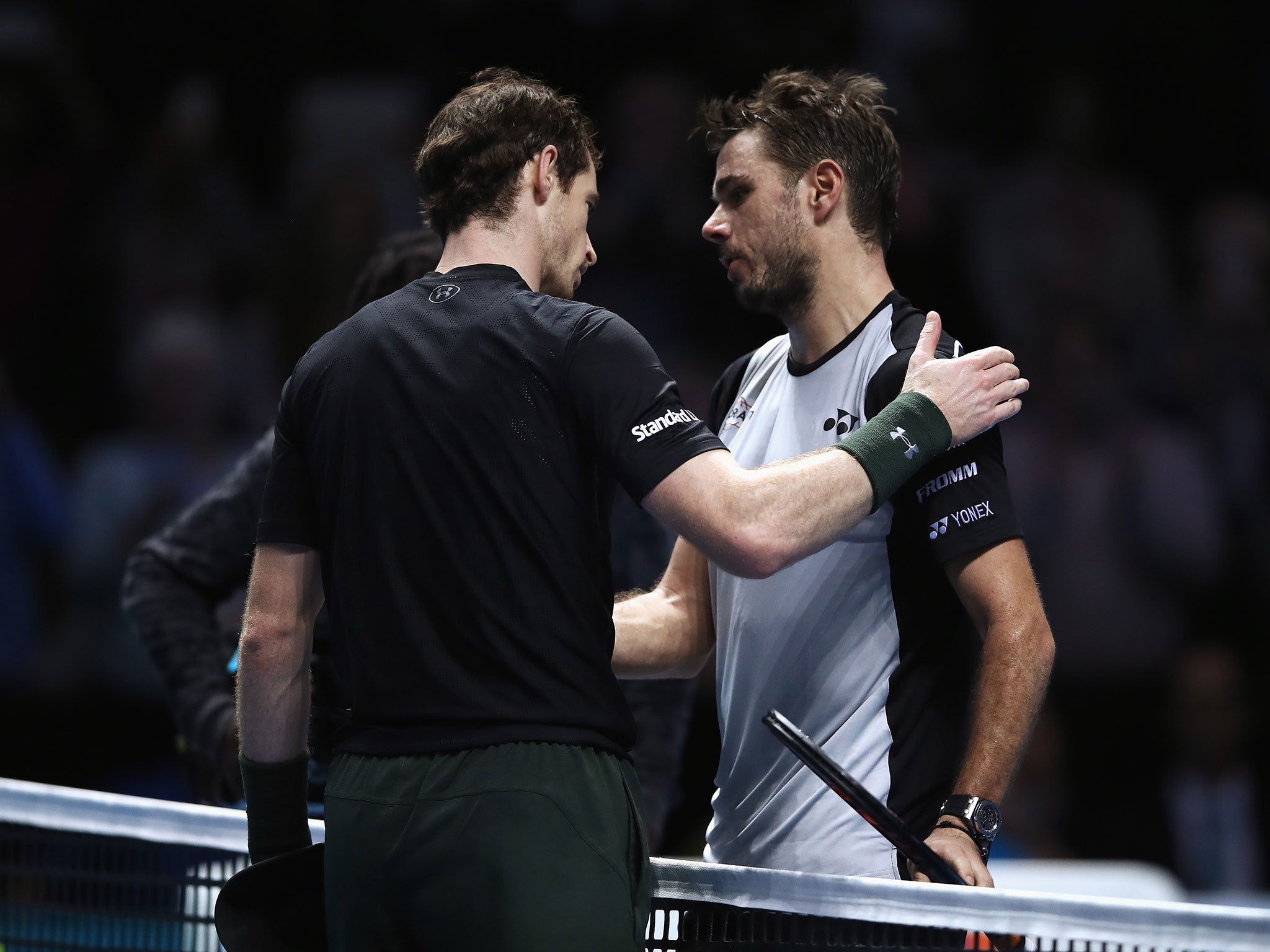 Andy Murray is congratulated by Stan Wawrinka after his group match victory at the ATP World Tour Finals