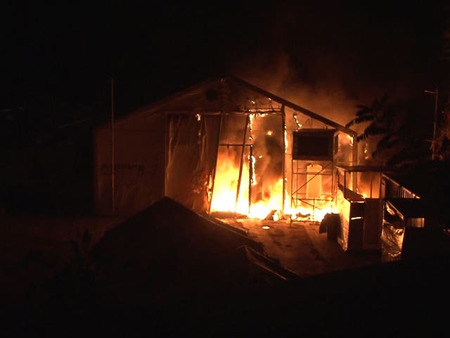 A tent burns during riots that broke out in the Souda municipality-run camp for refugees and migrants on the island of Chios, Greece, November 17, 2016.