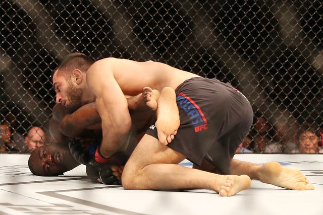Mousasi, on top, with Hall in the Octagon at UFC Fight Night 75