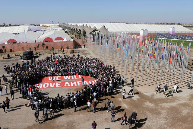 Greenpeace stage a protest outside the UN Climate Change Conference 2016 (COP22) in Marrakech, Morocco