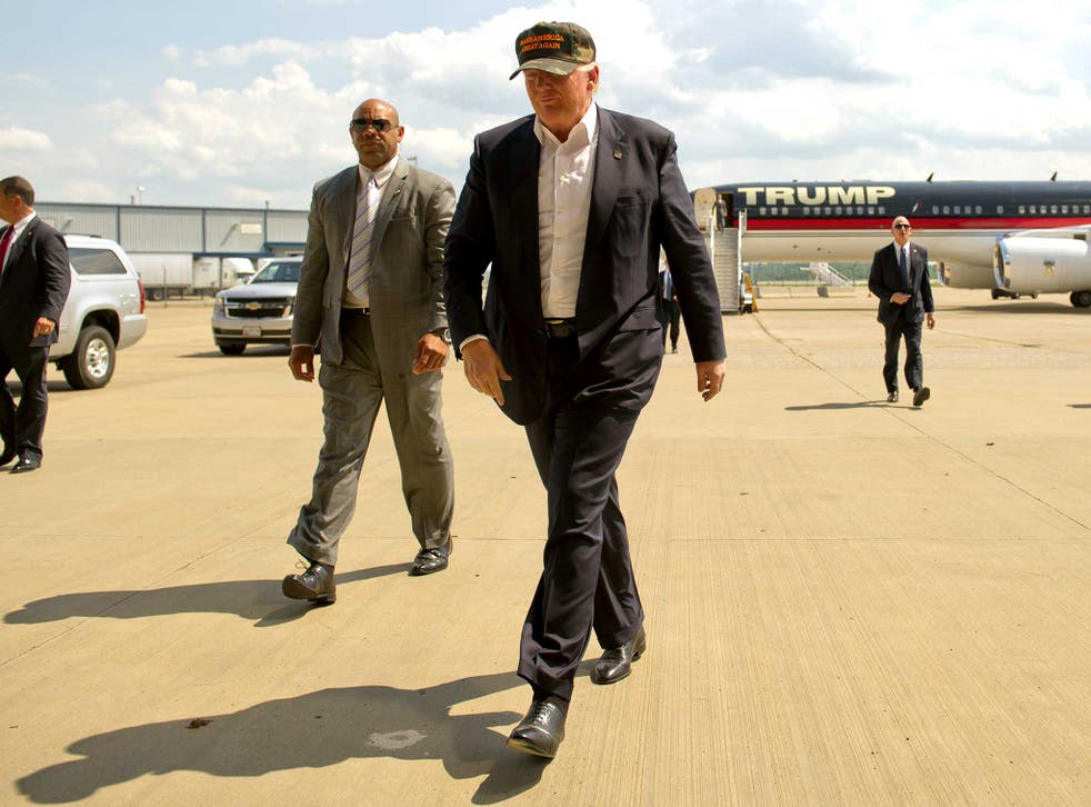 Donald Trump arrives in his plane to speak to supporters at a rally at Atlantic Aviation on June 11, 2016 in Moon Township, Pennsylvania.