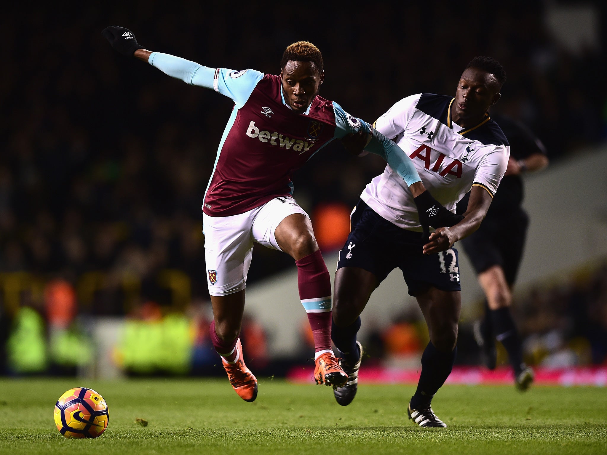 Sakho and Wanyama battle for the ball in the first half
