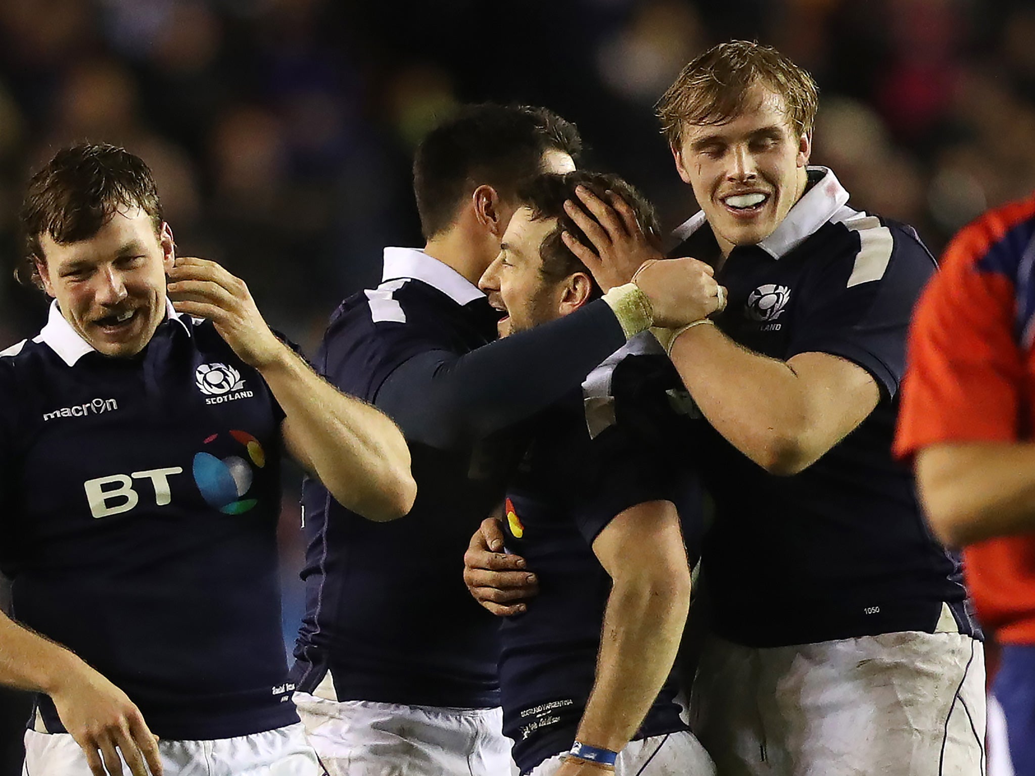 Laidlaw is embraced after securing the match-winning points