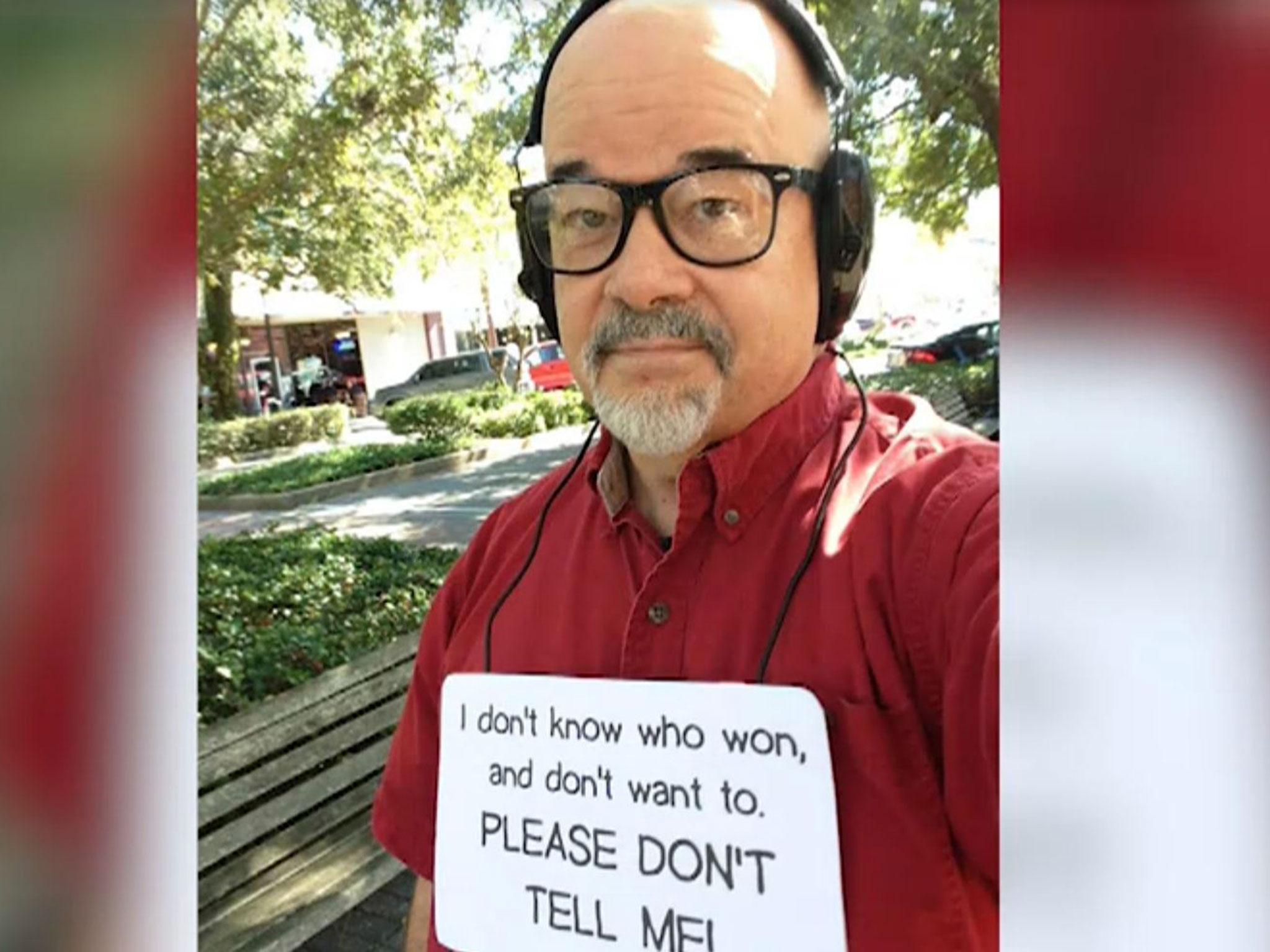 When he does leave his house, Joel Chandler wears headphones and a sign reading: 'I don't know who won, and don't want to. Please don't tell me!'