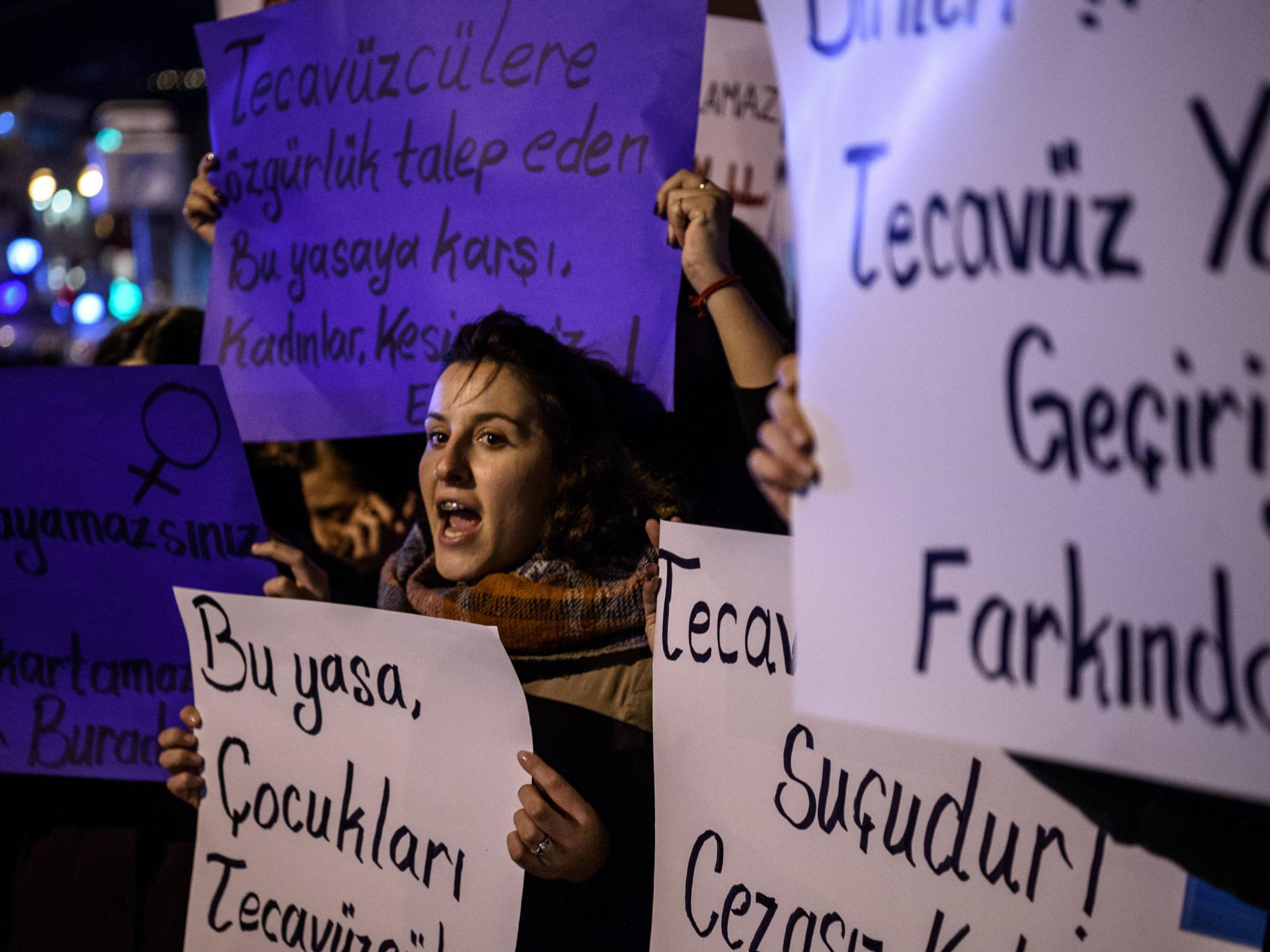 Women in Istanbul shout and hold placards saying ‘rape is a human crime’