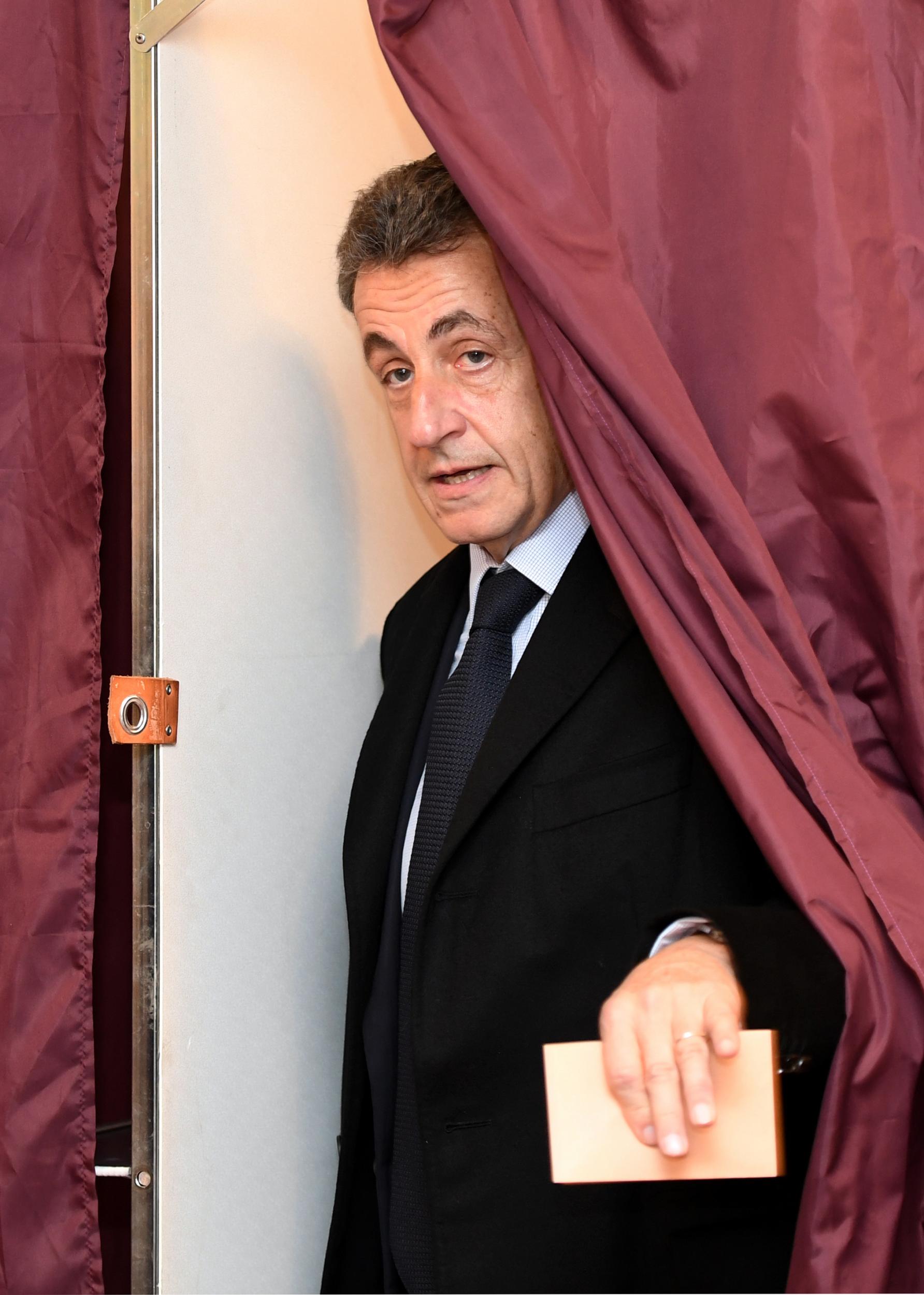 Nicolas Sarkozy, former French president and candidate for the French conservative presidential primary, votes in the first round of the French center-right presidential primary election in Paris, France, November 20, 2016