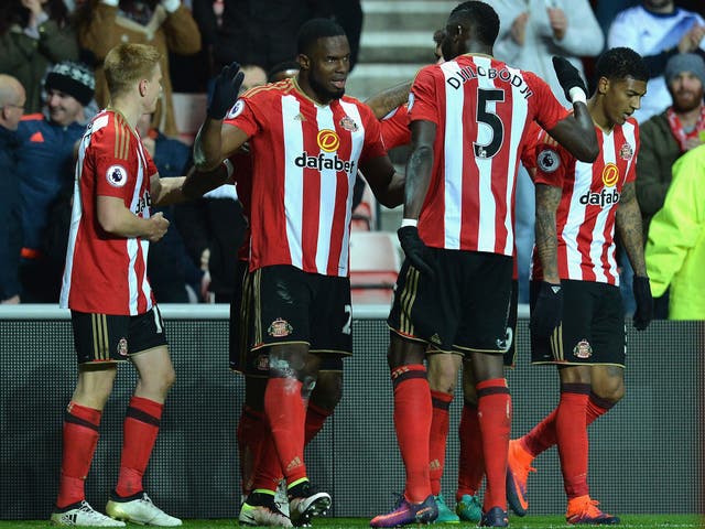Victor Anichebe is congratulated by his teammates following his second goal