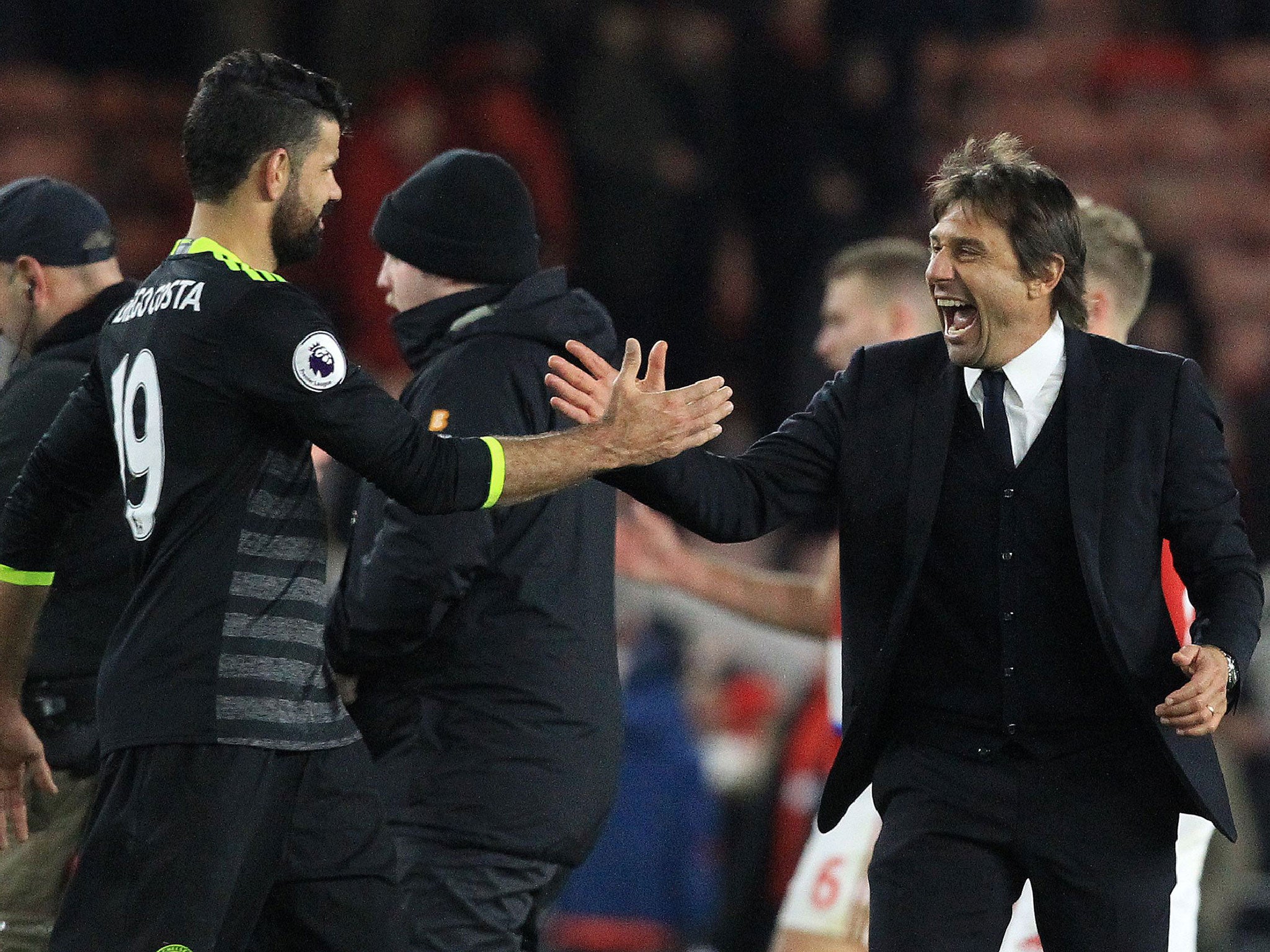 Antonio Conte celebrates with Diego Costa after the striker pounced to score his tenth goal this season