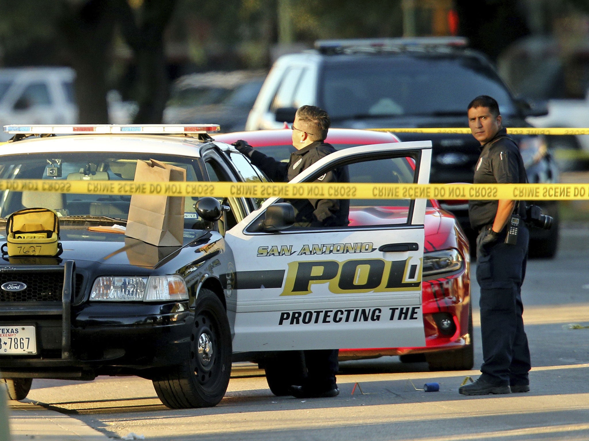 San Antonio police investigate the scene where Det. Benjamin Marconi was shot