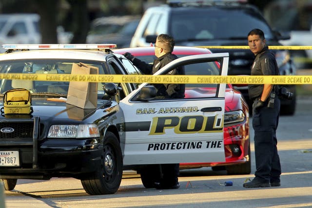 San Antonio police investigate the scene where Det. Benjamin Marconi was shot