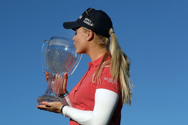 Hull poses with her first LPGA trophy