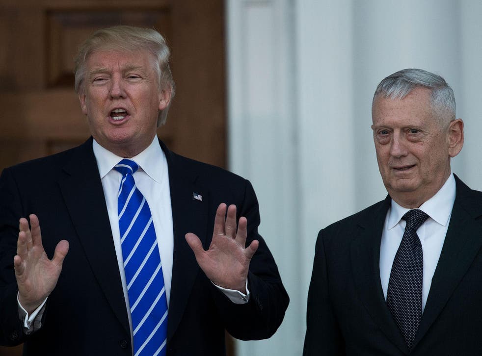President-elect Donald Trump speaks to reporters as he stands alongside retired United States Marine Corps general James Mattis after their meeting at Trump International Golf Club, 19 November, 2016, in Bedminster Township, New Jersey