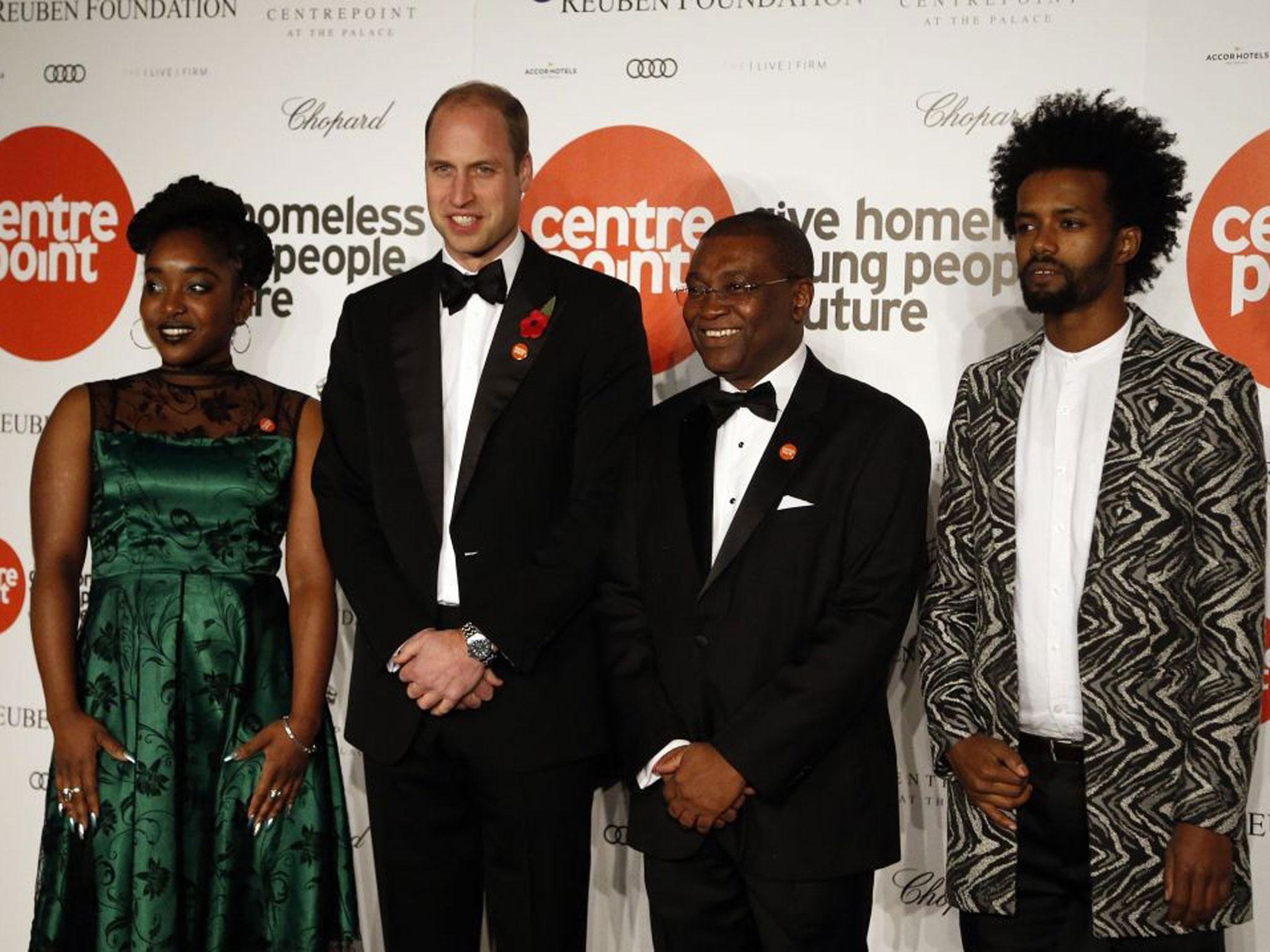 Prince William and (second right) Centrepoint CEO Seyi Obakin attend Centrepoint at the Palace, a fundraising event in the grounds of Kensington Palace
