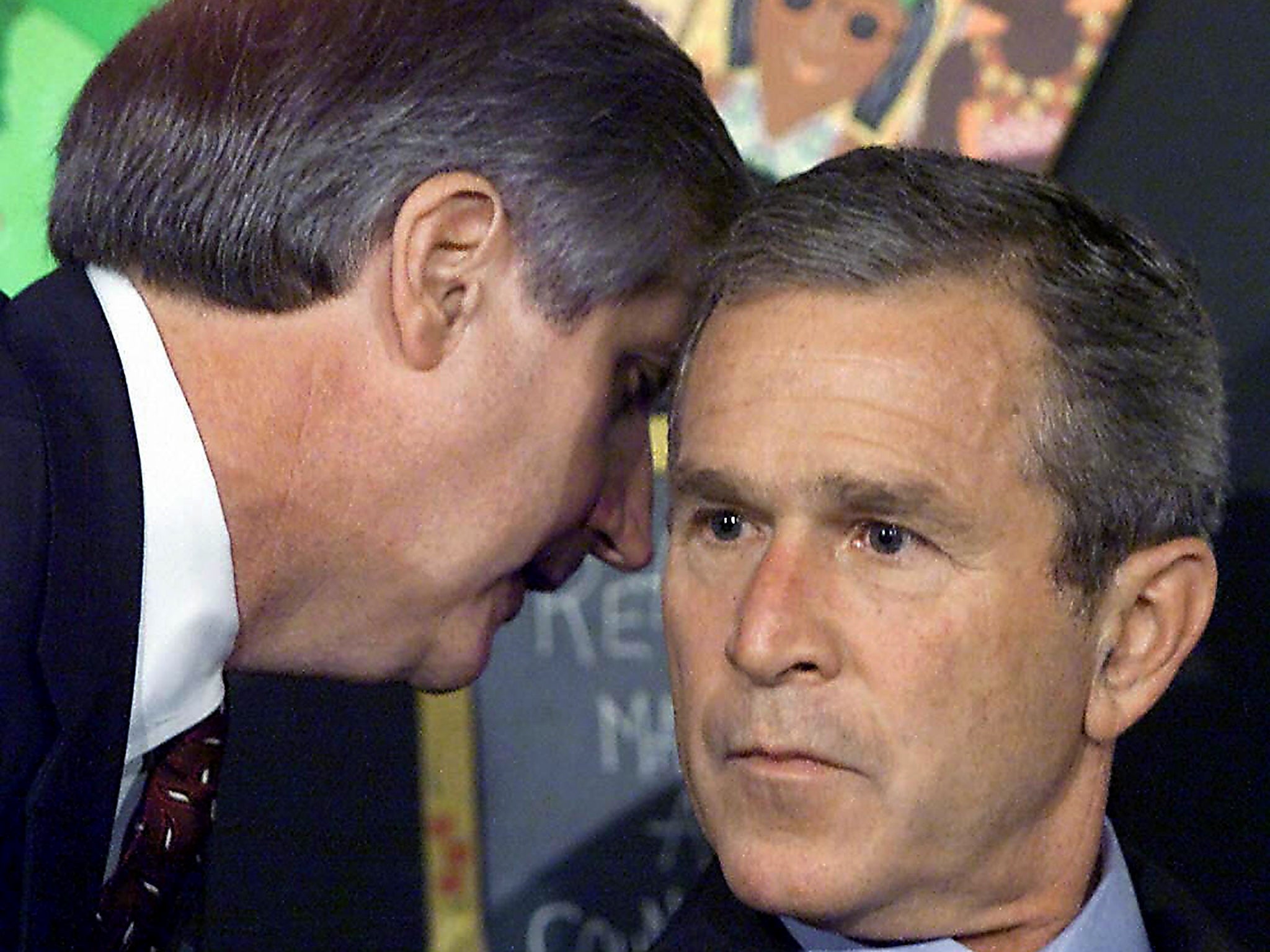 White house Chief of Staff Andrew Card informing President George W Bush of the 9/11 attacks in 2001