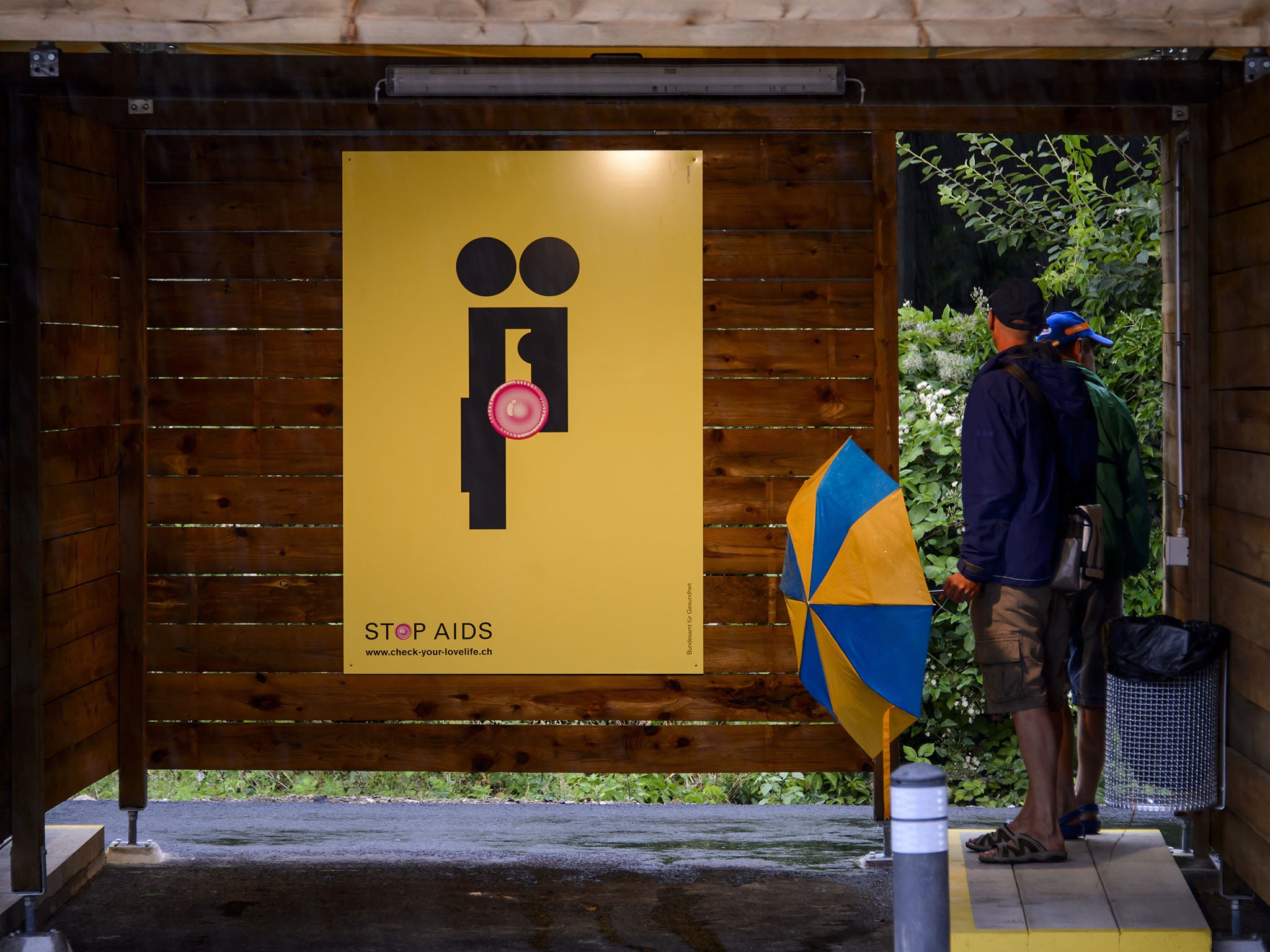 Each stall is decorated with an HIV or sex education poster, a condom disposal bin and a panic button