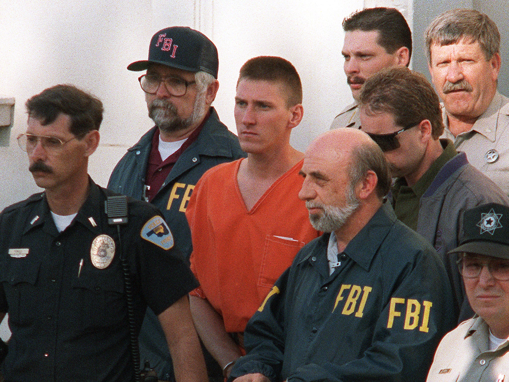 Timothy McVeigh being led from a courthouse after being charged with involvement in the 1995 bombing of a federal building in Oklahoma City