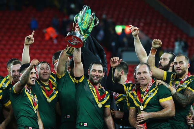 Cameron Smith of Australia lifts the trophy with team mates after victory in the Four Nations Final