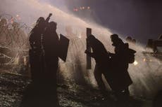 Police turn water cannons on pipeline protesters in freezing weather