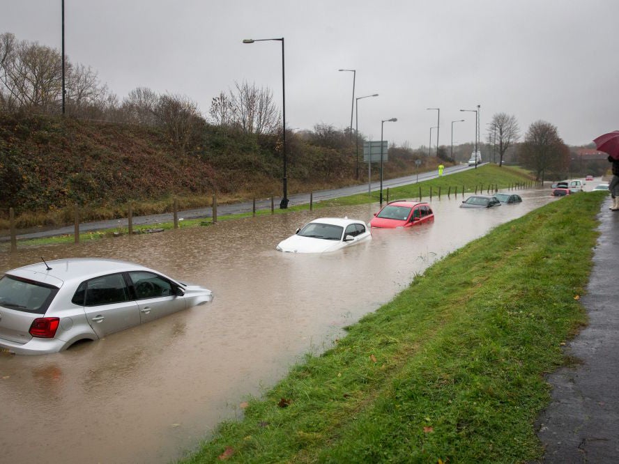 Cars submerged under several feet of flood water are abandoned in Hartcliffe (Getty Images )