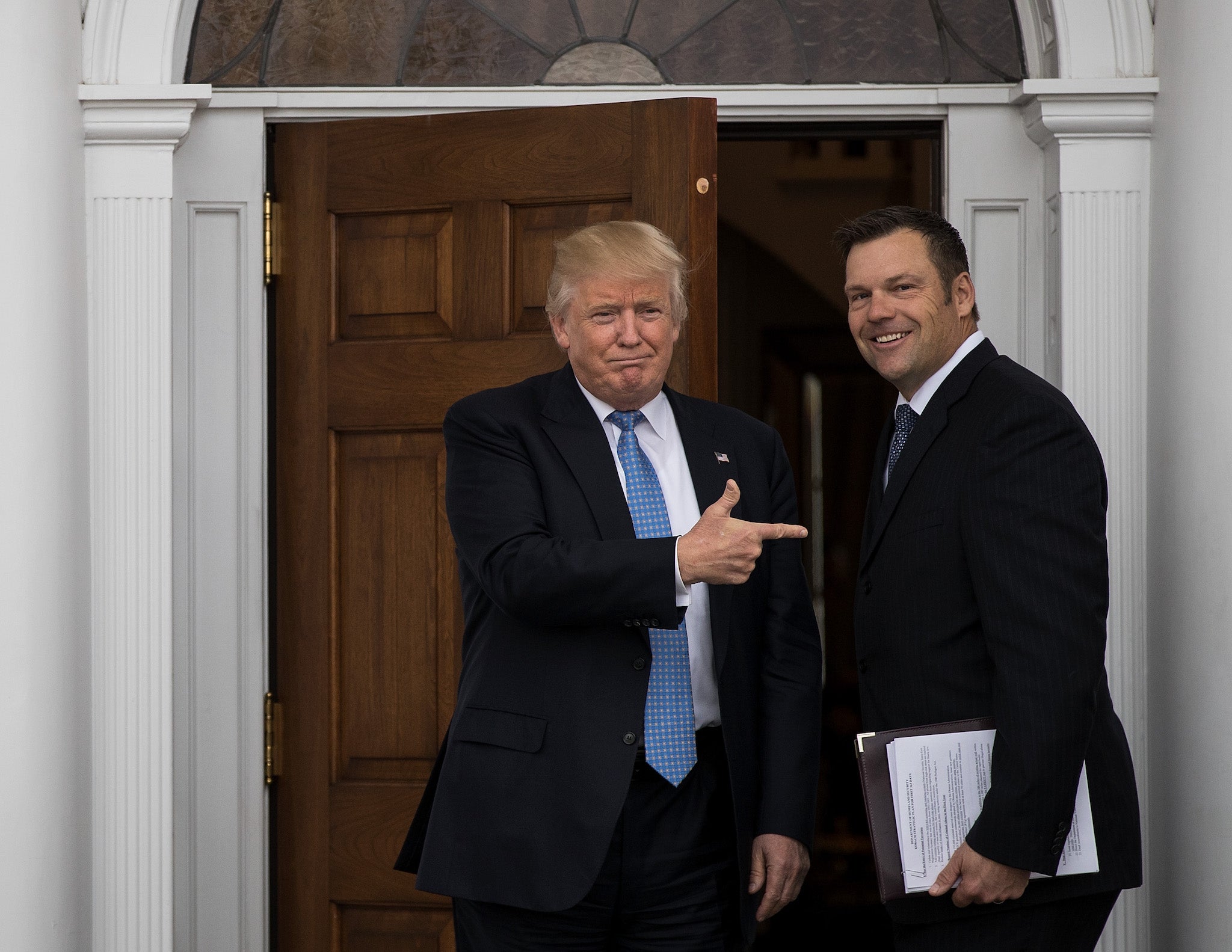 President-elect Donald Trump and Kris Kobach, Kansas secretary of state, pose for a photo following their meeting in New Jersey on 20 November 2016