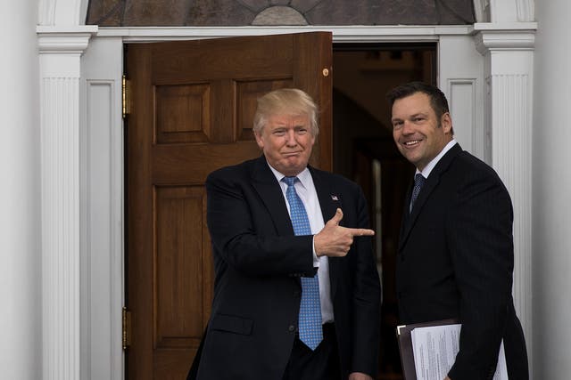 President-elect Donald Trump and Kris Kobach, Kansas secretary of state, pose for a photo following their meeting in New Jersey on 20 November 2016