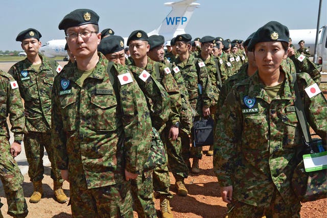 Members of the Japanese Ground Self-Defence Force (GSDF) arrive at the airport in Juba, South Sudan, on 21 November, 2016
