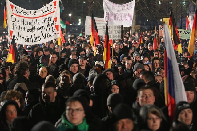 Researchers say the word 'Volksverrater' ('Traitor of the people') is increasingly heard during anti-refugee protests such as those held by the anti-Islam Pegida movement