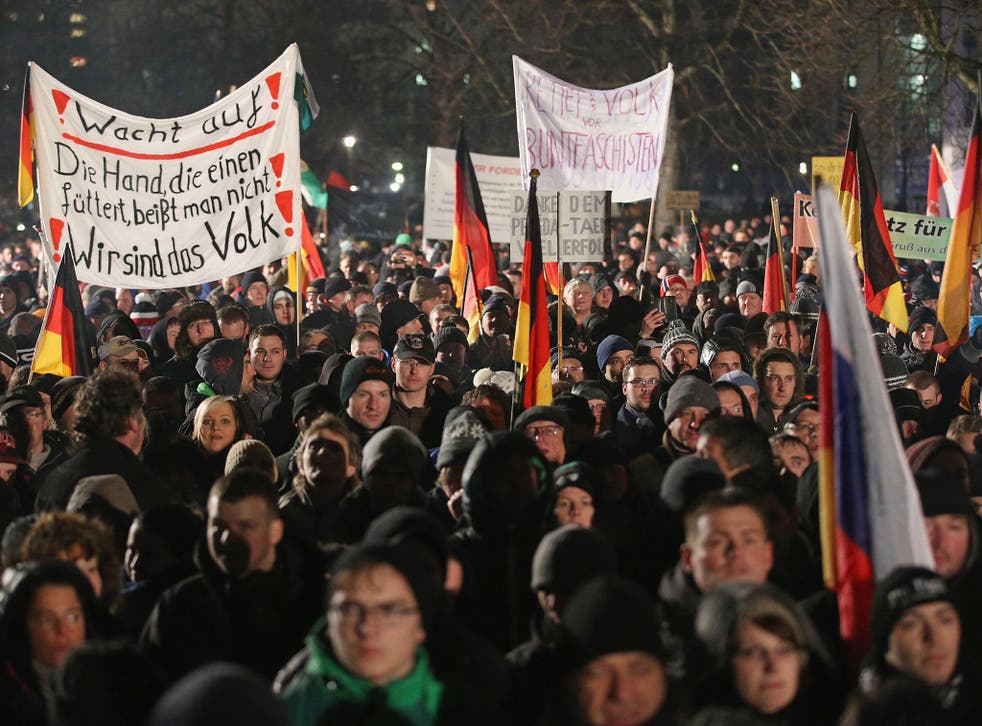 Researchers say the word 'Volksverrater' ('Traitor of the people') is increasingly heard during anti-refugee protests such as those held by the anti-Islam Pegida movement