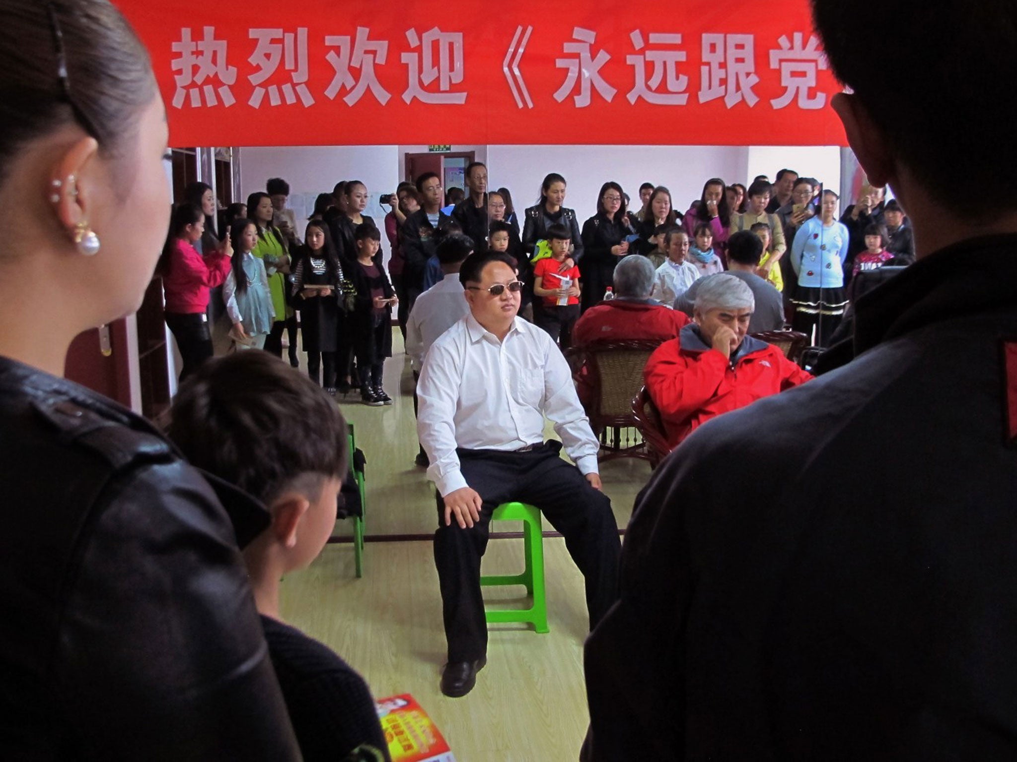 Jia Yongtang, in costume as Kim Jong Un, helps judge a talent show at a dance school in Taiyuan, China, last month