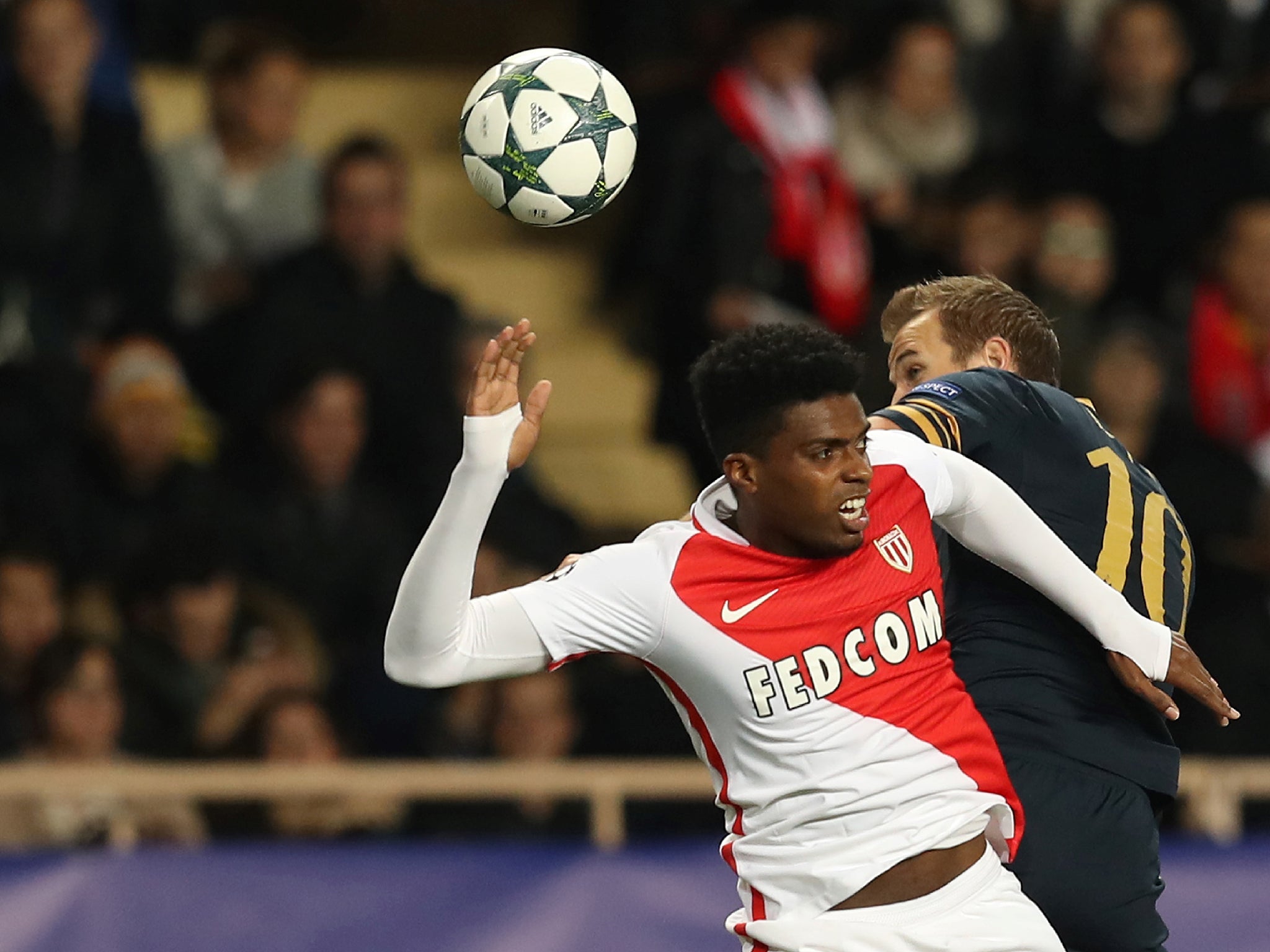 Monaco's Jemerson contests an aerial ball with Kane
