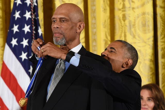 NBA legend Kareem Abdul-Jabbar is 7 foot 2, which made this part of the event a challenge even for Mr Obama, who is 6 foot 1