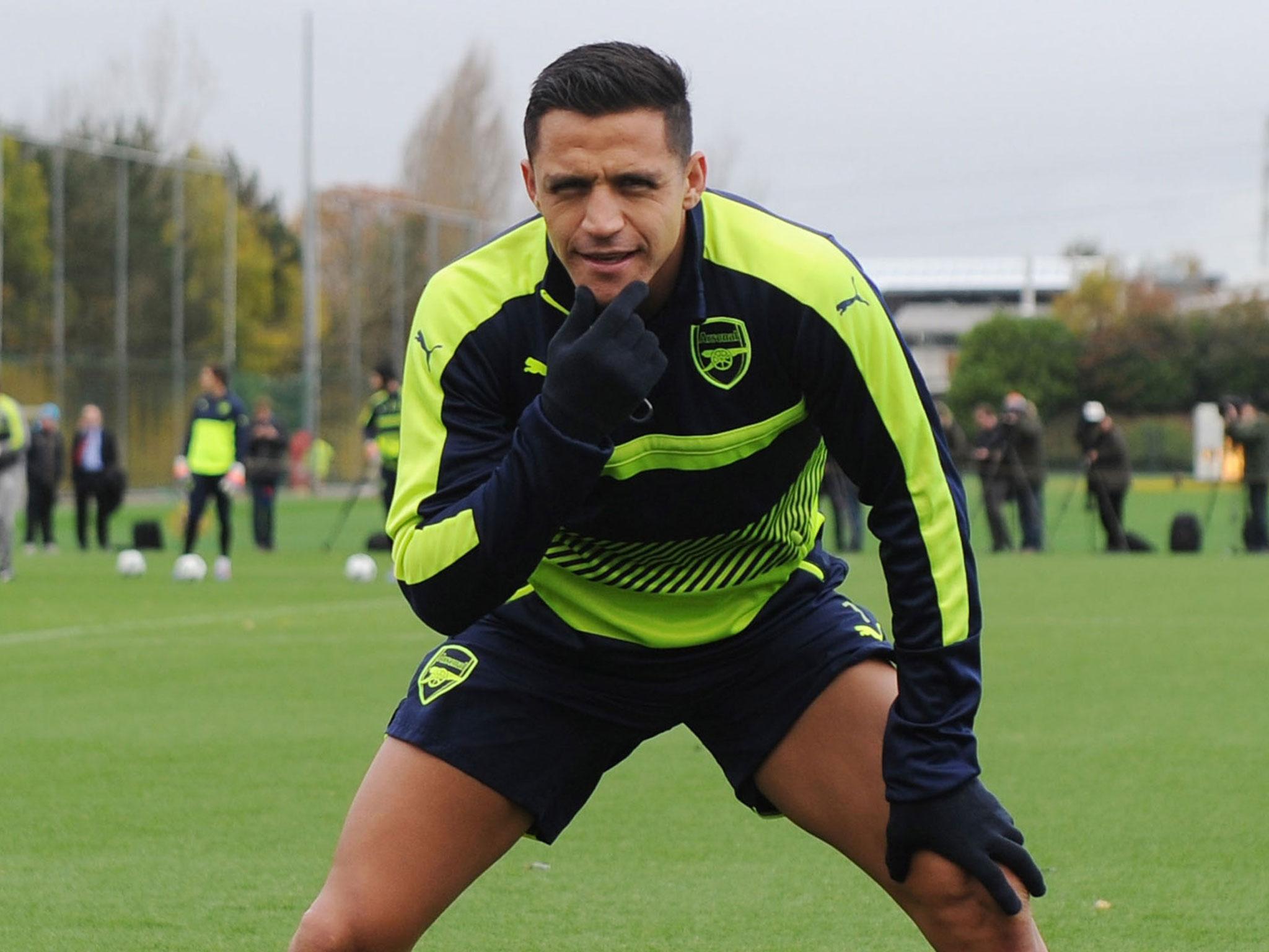 Alexis Sanchez trains with the rest of the Arsenal squad ahead of their match against PSG