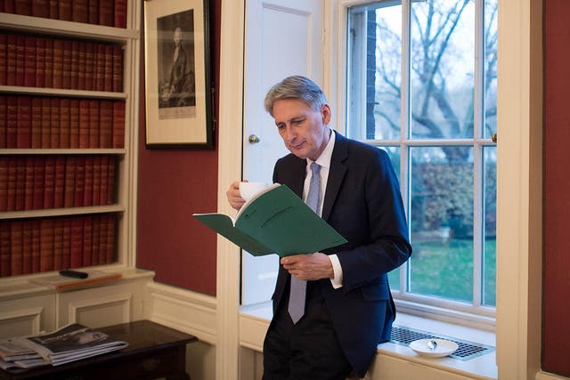 The Chancellor reads through his Autumn Statement in his office in 11 Downing Street