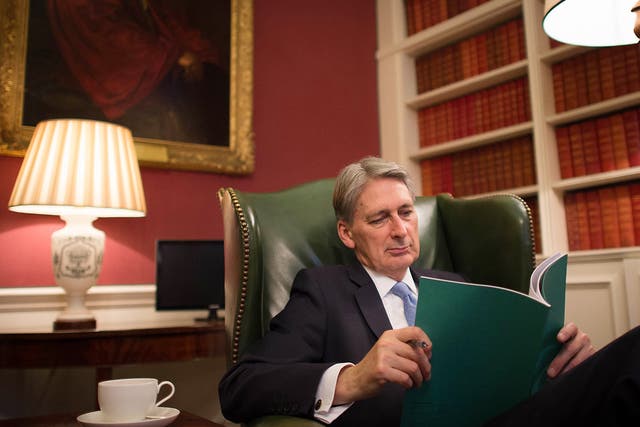 Chancellor Philip Hammond reads through his Autumn Statement in 11 Downing Street