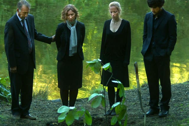 The family at the pond in Black Pond (2011) starring Chris Langham (left) in a debut film by Tom Kingsley and Will Sharpe