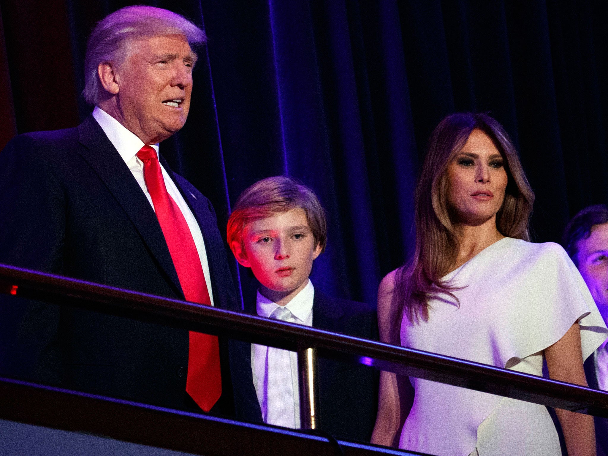President-elect Donald Trump, left, arrives to speak at an election night rally with his son Barron and wife Melania, in New York.