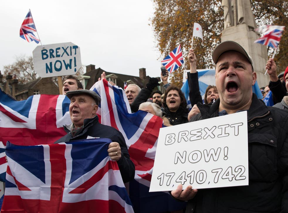 Participants of a demonstration calling for Brexit shout holding banners written 'Brexit now' at the Old Palace Yard in London