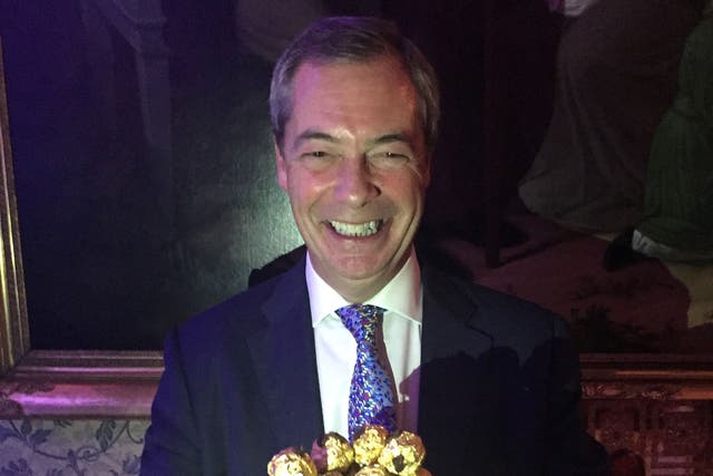 Nigel Farage is presented with a tray of Ferrero Rocher chocolates at an event to thank him for his contribution to Brexit, at The Ritz, London.