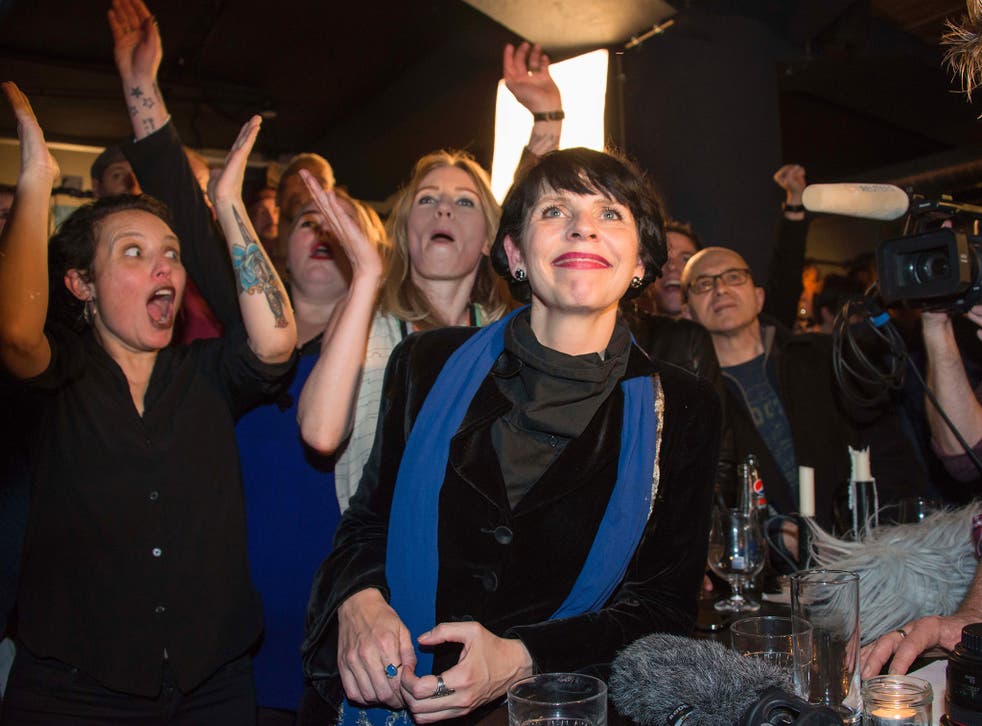 Pirate Party leader Birgitta Jonsdottir surrounded by supporters on election night where the party came third