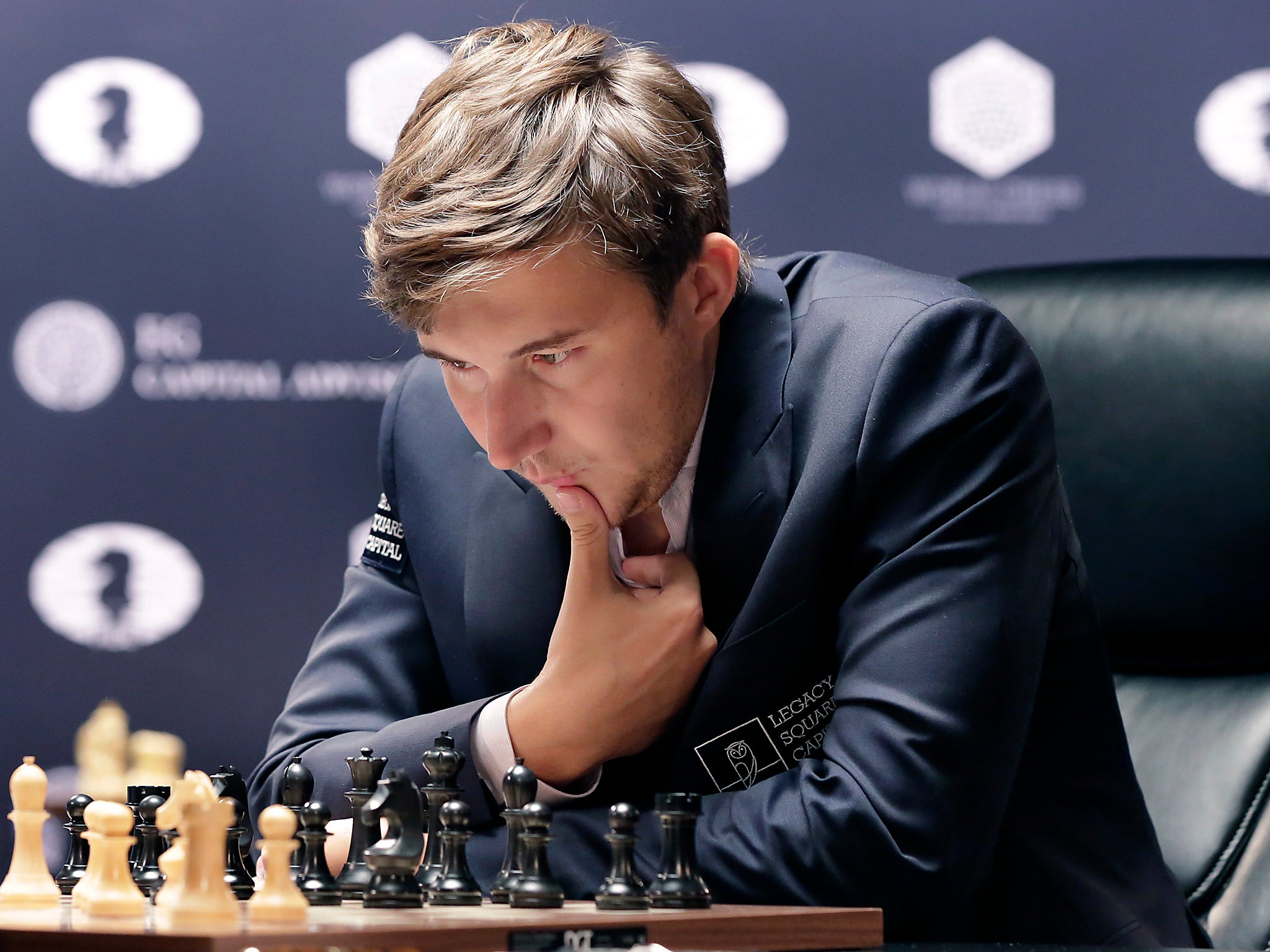 Sergey Karjakin studies the board