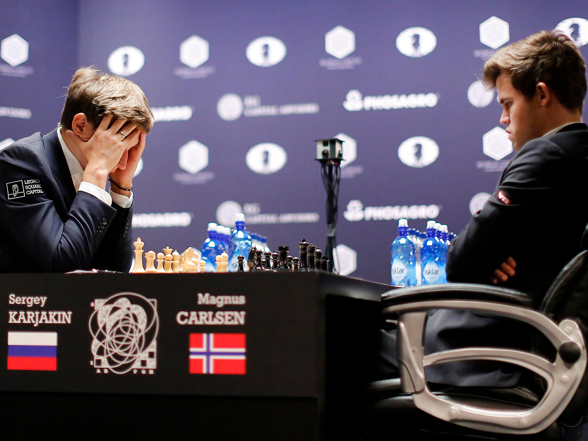Mind games: Sergey Karjakin contemplates his move against Magnus Carlsen during round nine of the final last week