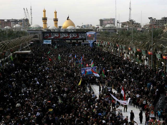 Shia Muslim pilgrims gather outside the Imam Hussein shrine on the last day of the Arbaeen religious festival