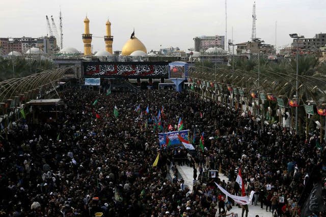 Shia Muslim pilgrims gather outside the Imam Hussein shrine on the last day of the Arbaeen religious festival